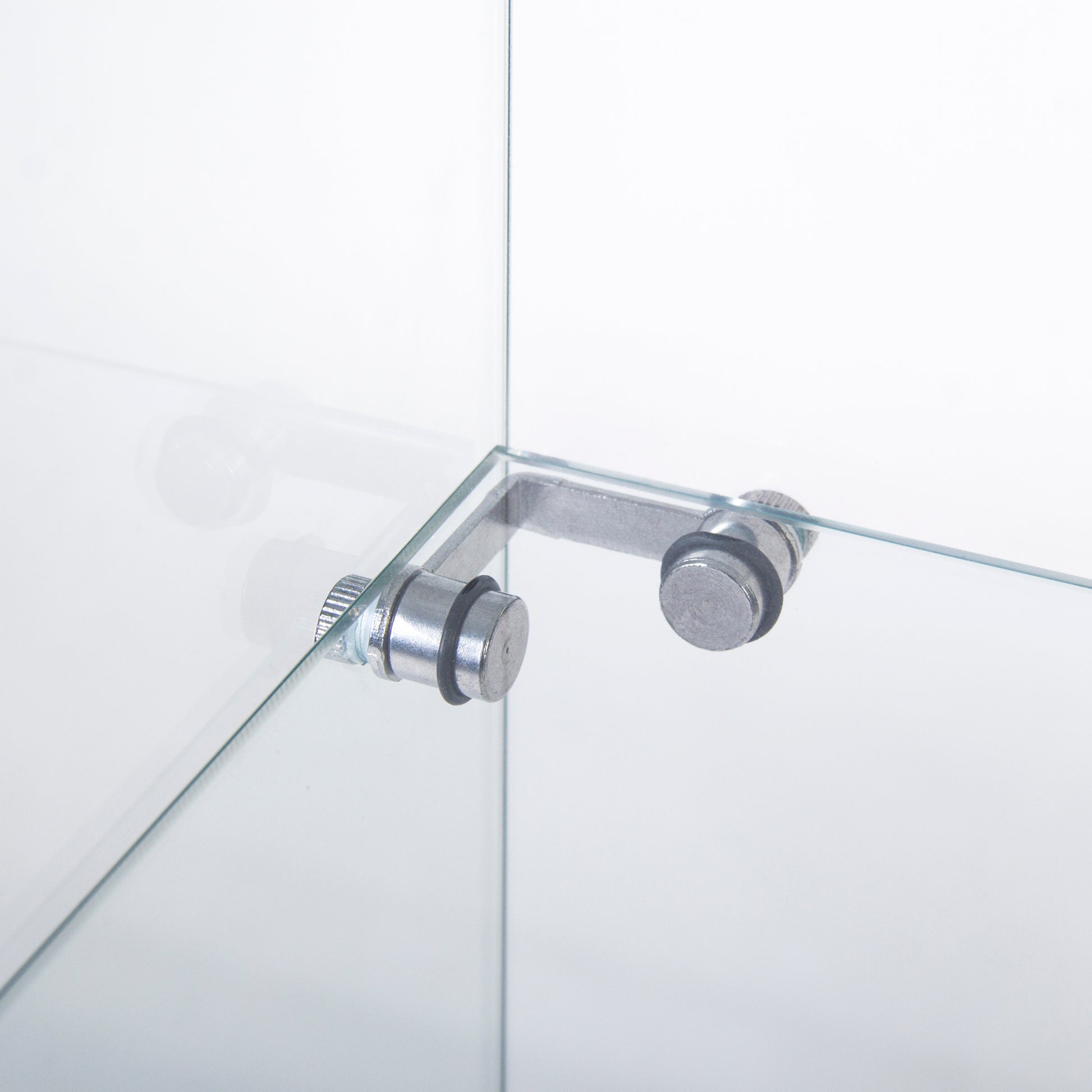 Closeup of a silver metal Lbracket securing two clear glass panes