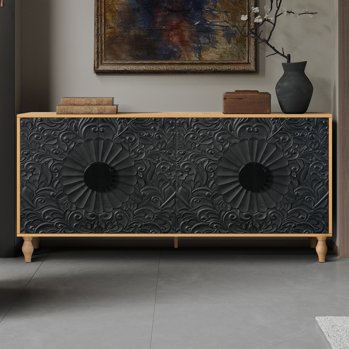 Black carved sideboard with ornate floral details and wooden legs