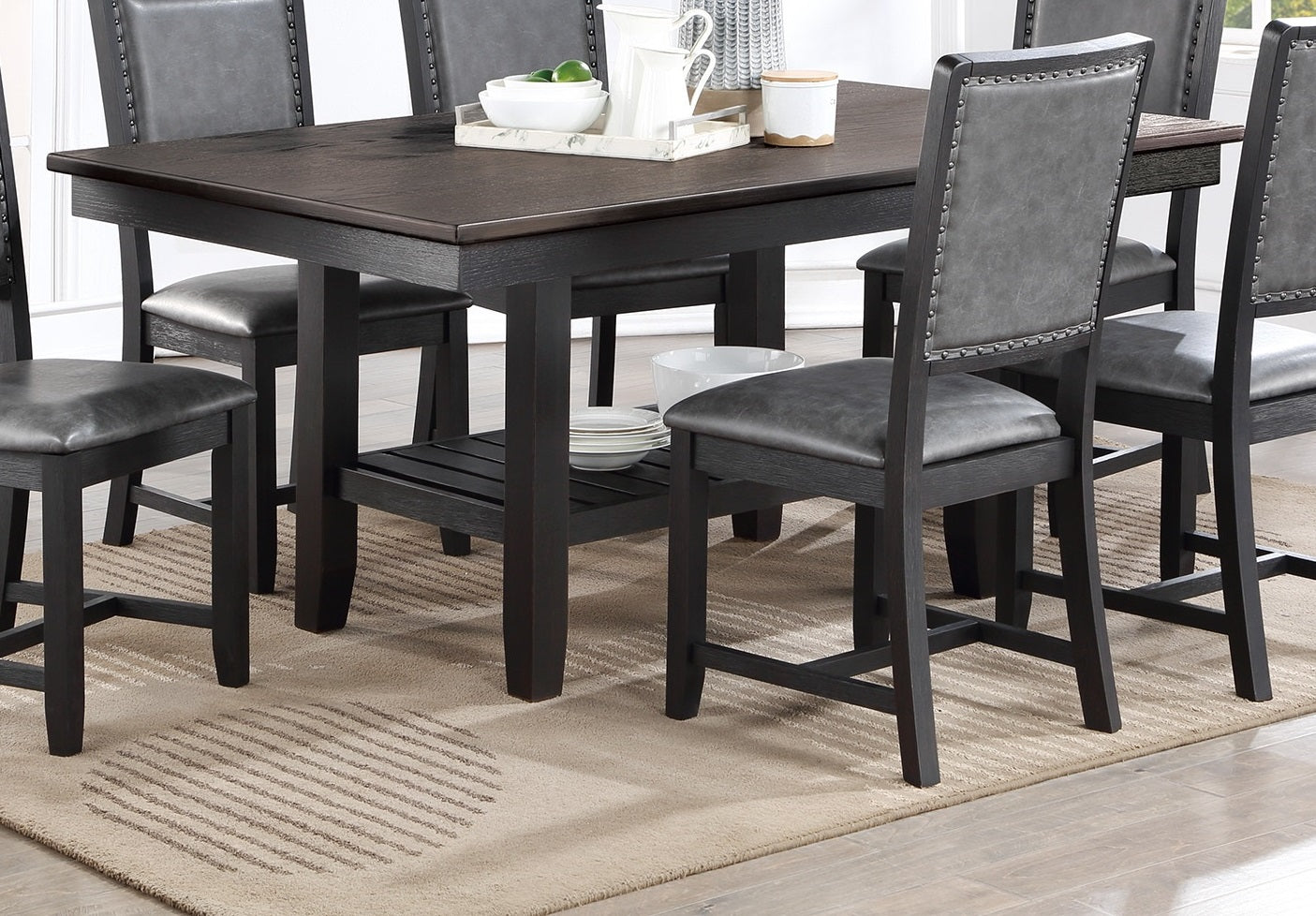 Dark wood counter height table with gray faux leather chairs