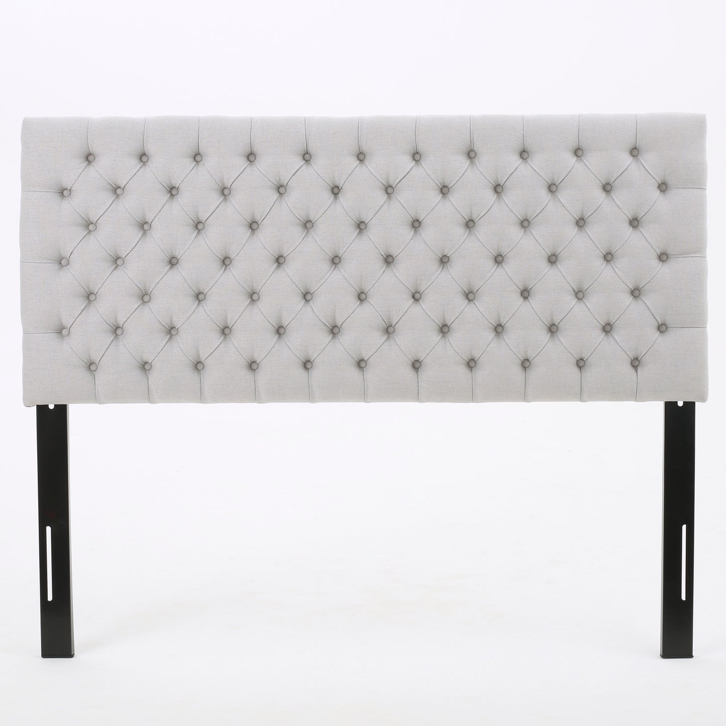 Light gray fabric upholstered tufted headboard with black metal legs