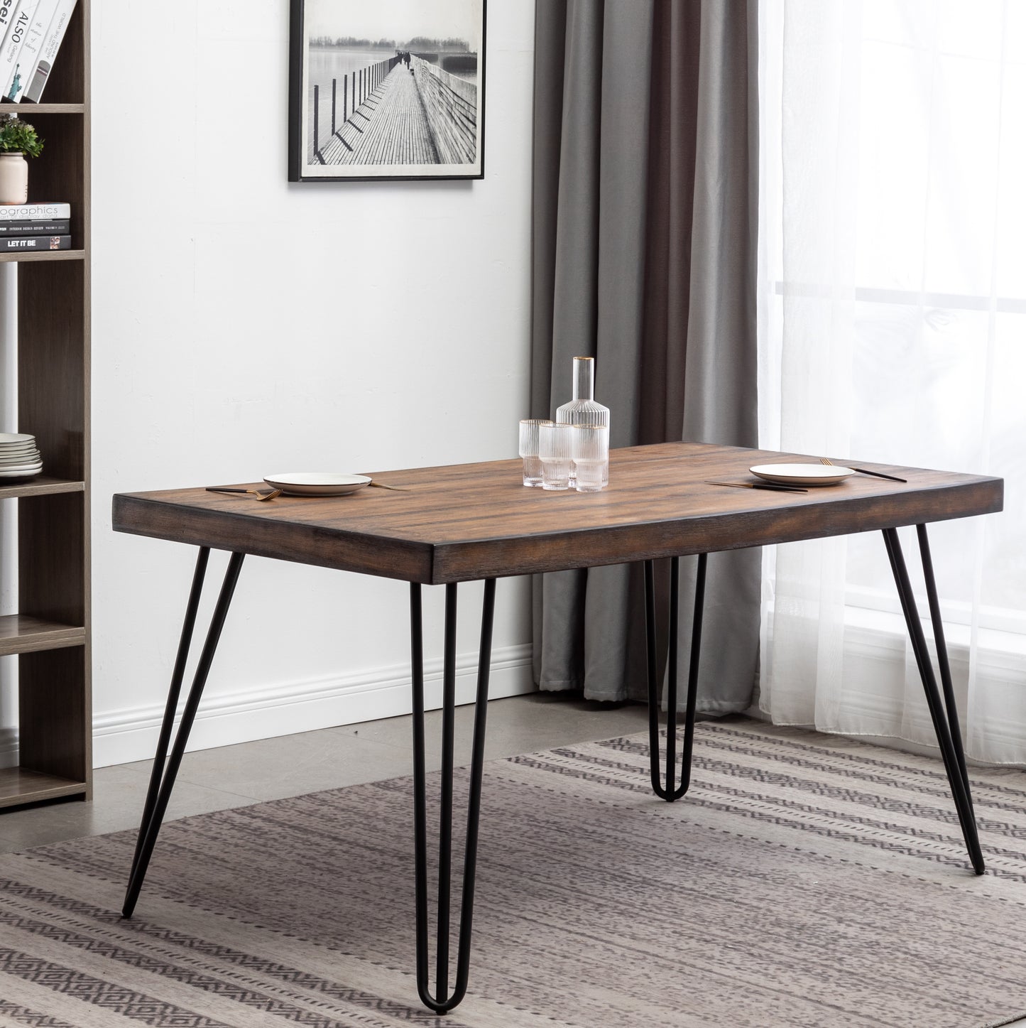 Rustic dark wood dining table with black hairpin legs set for two