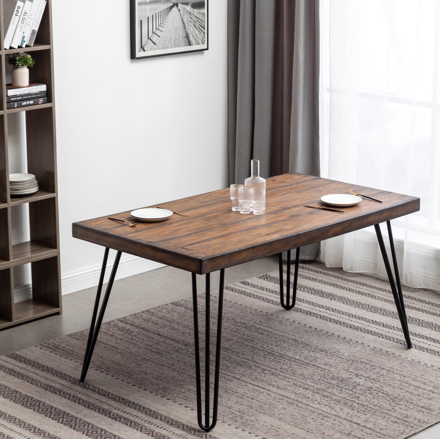 Rustic wood dining table with black hairpin legs set for two