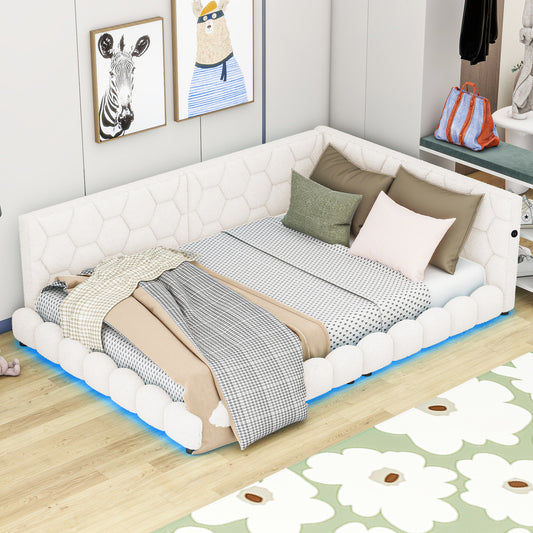 White upholstered sectional daybed with patterned bedding and throws