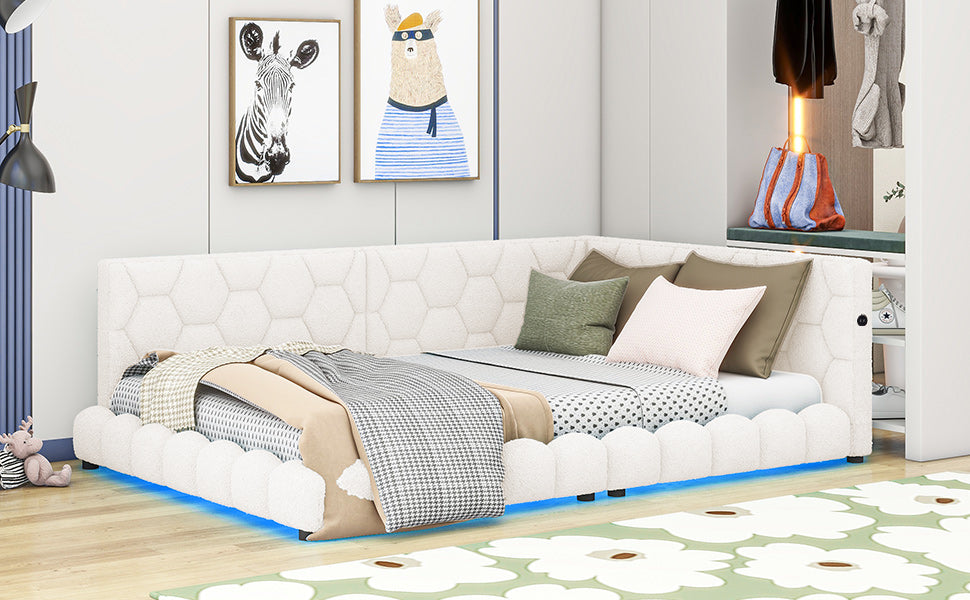 White tufted corner daybed with honeycomb pattern and blue LED accent lighting