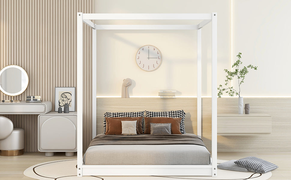 Modern white metal canopy bed with neutral bedding