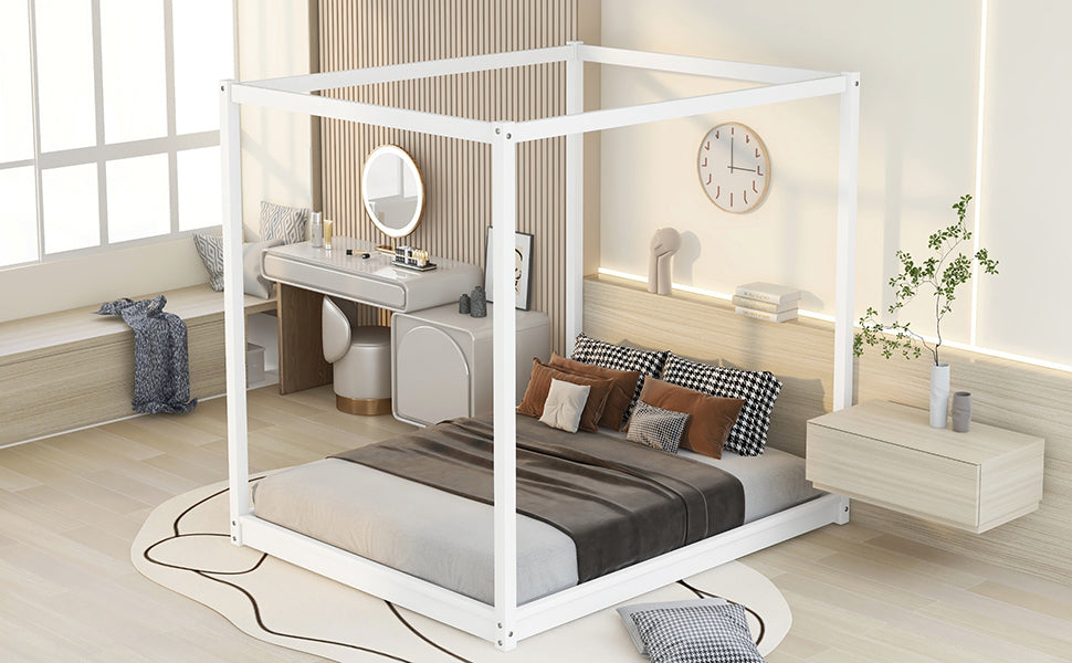 Modern white metal canopy bed frame with plush bedding and decorative pillows