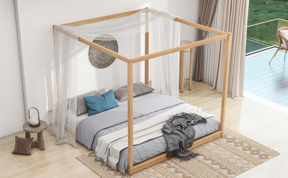 Minimalist wood canopy bed with sheer drapes and grey bedding