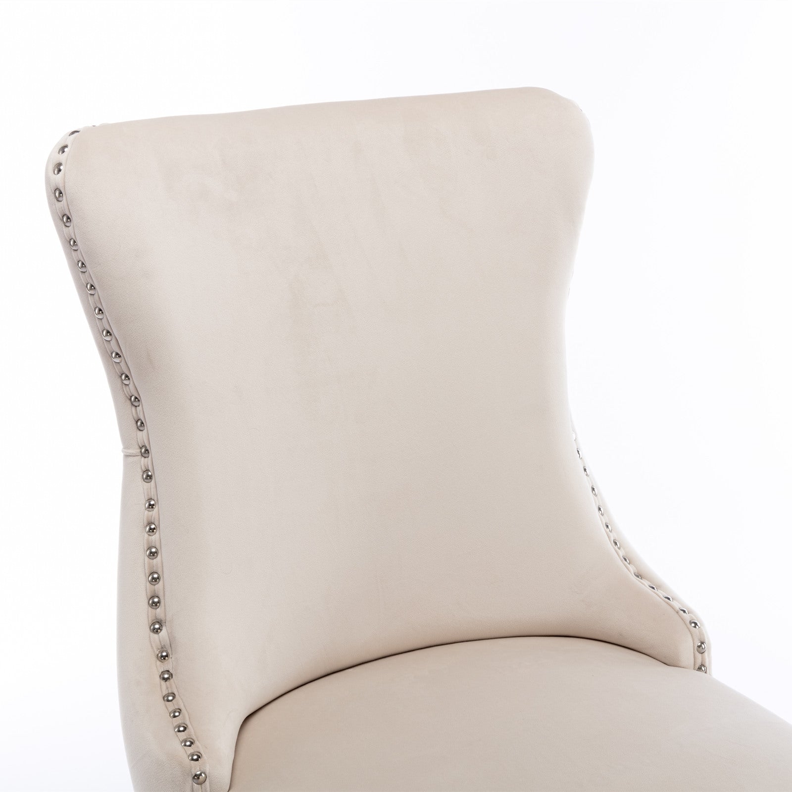 Cream velvet wingback dining chair with silver nailhead trim detail