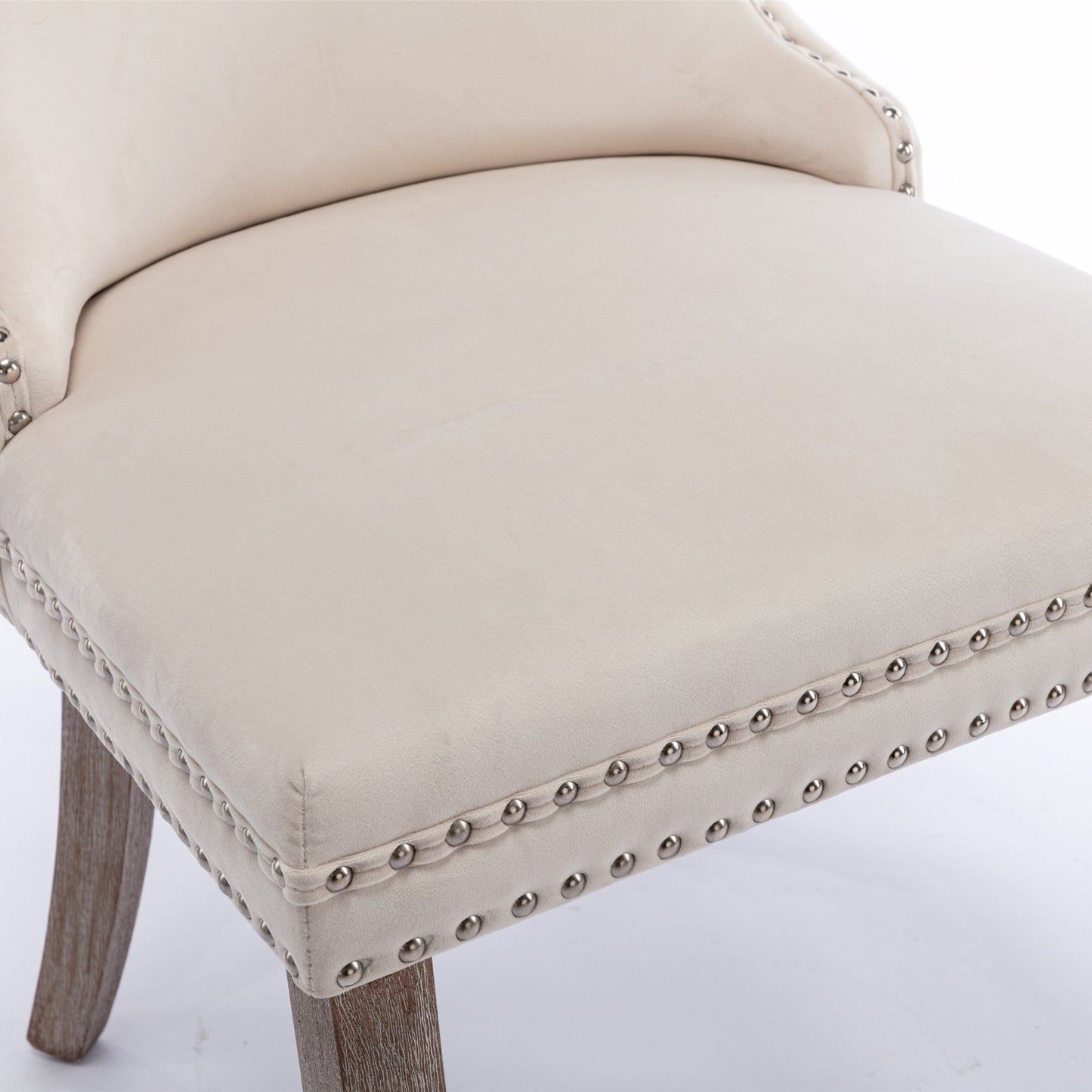 Cream velvet upholstered stool with antique brass nailhead trim and distressed wood legs