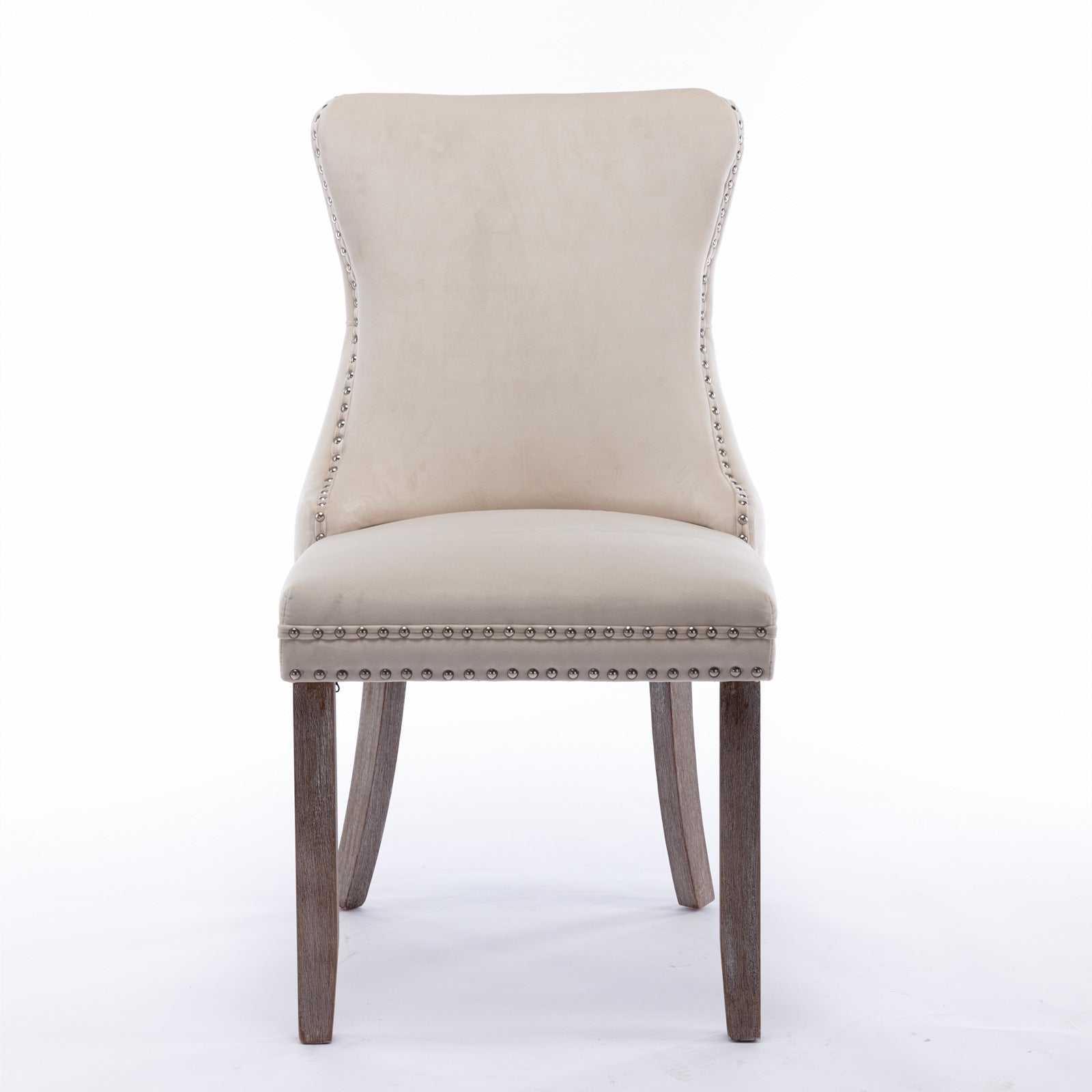 Tufted beige velvet dining chair with silver nailhead trim and wooden legs