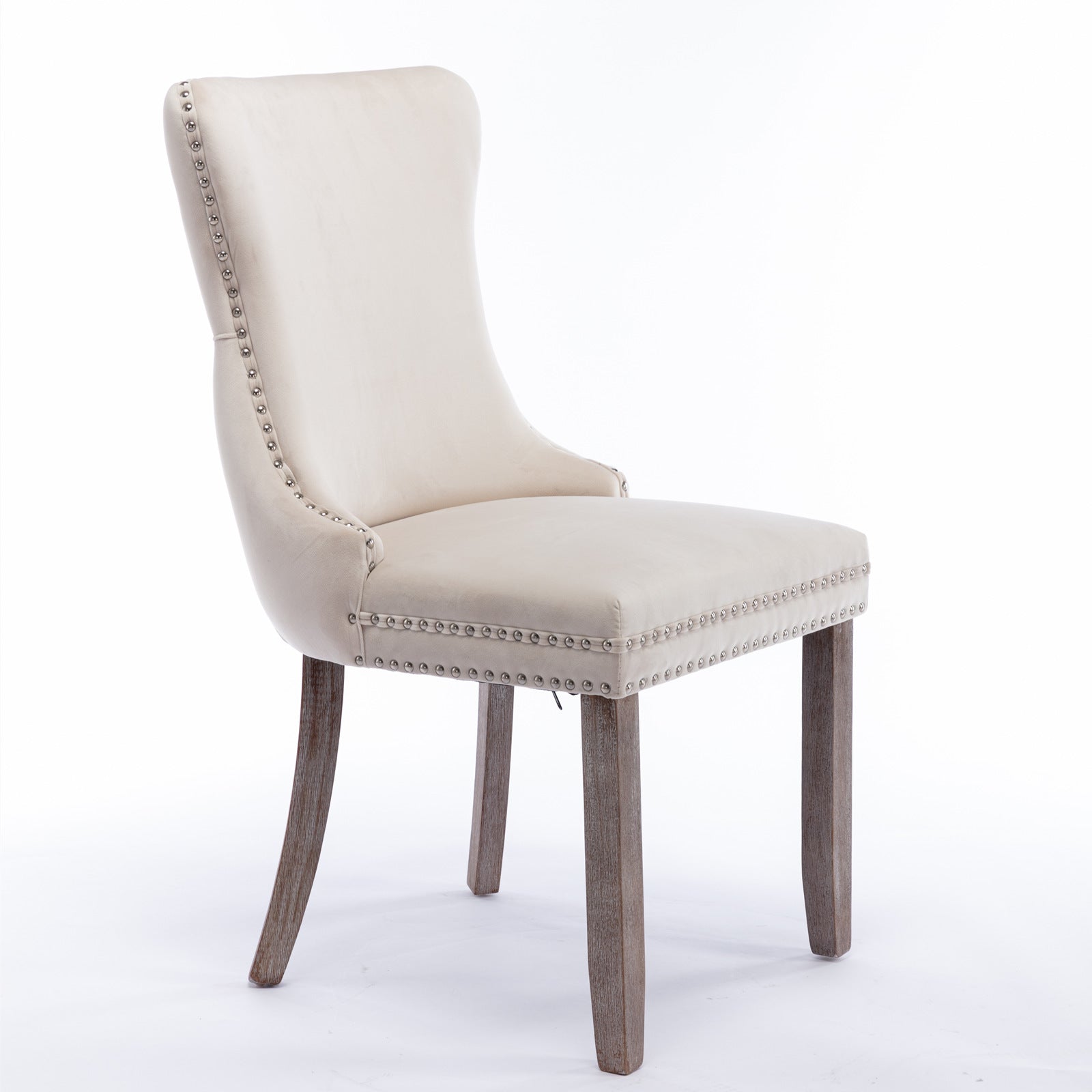 Cream velvet dining chair with silver nailhead trim and wood legs
