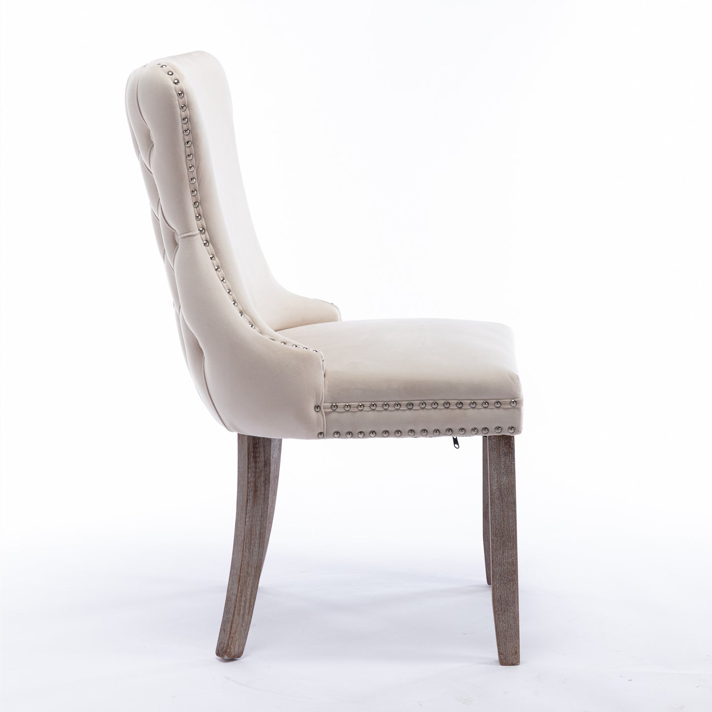 Cream velvet dining chair with button tufting and silver nailhead trim