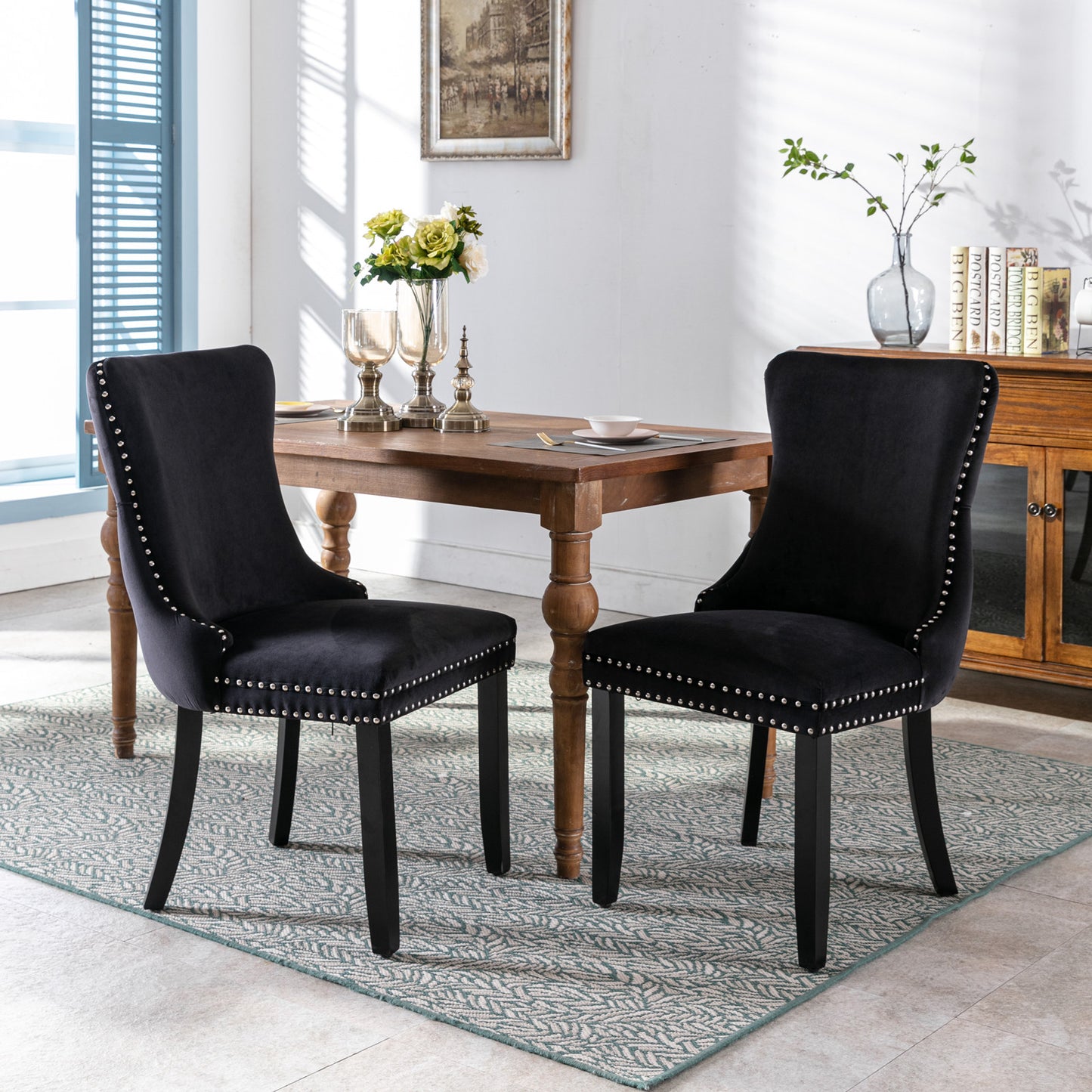 Black velvet dining chair with silver stud accents