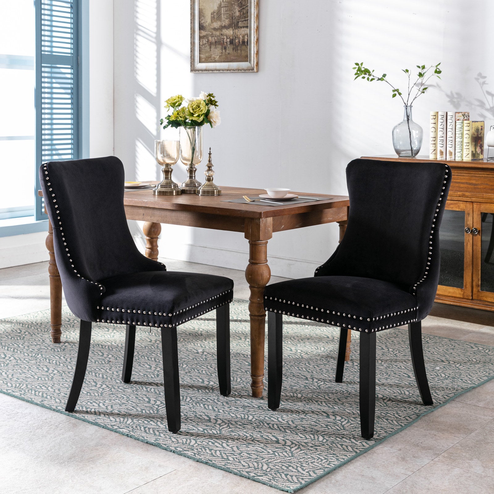 Black velvet dining chair with silver stud accents
