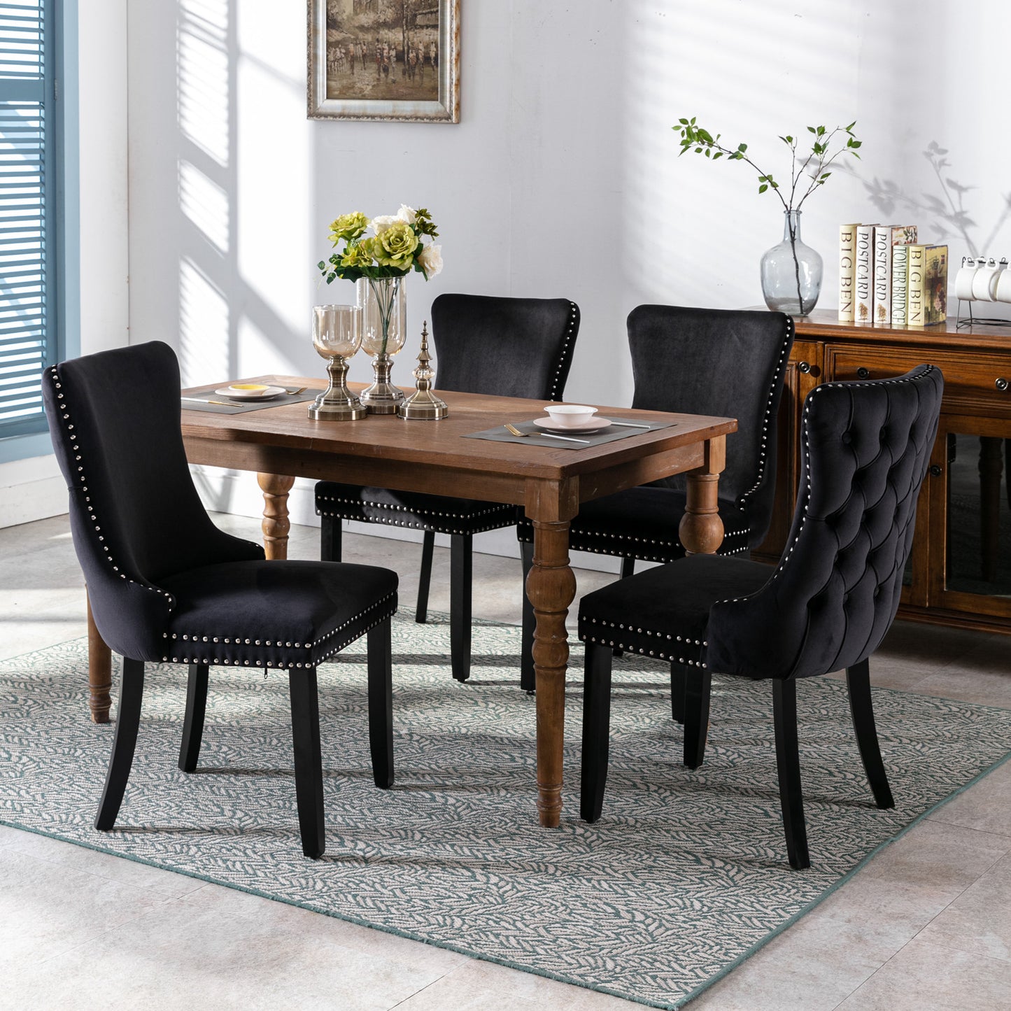 Black velvet dining chair with silver nailhead trim