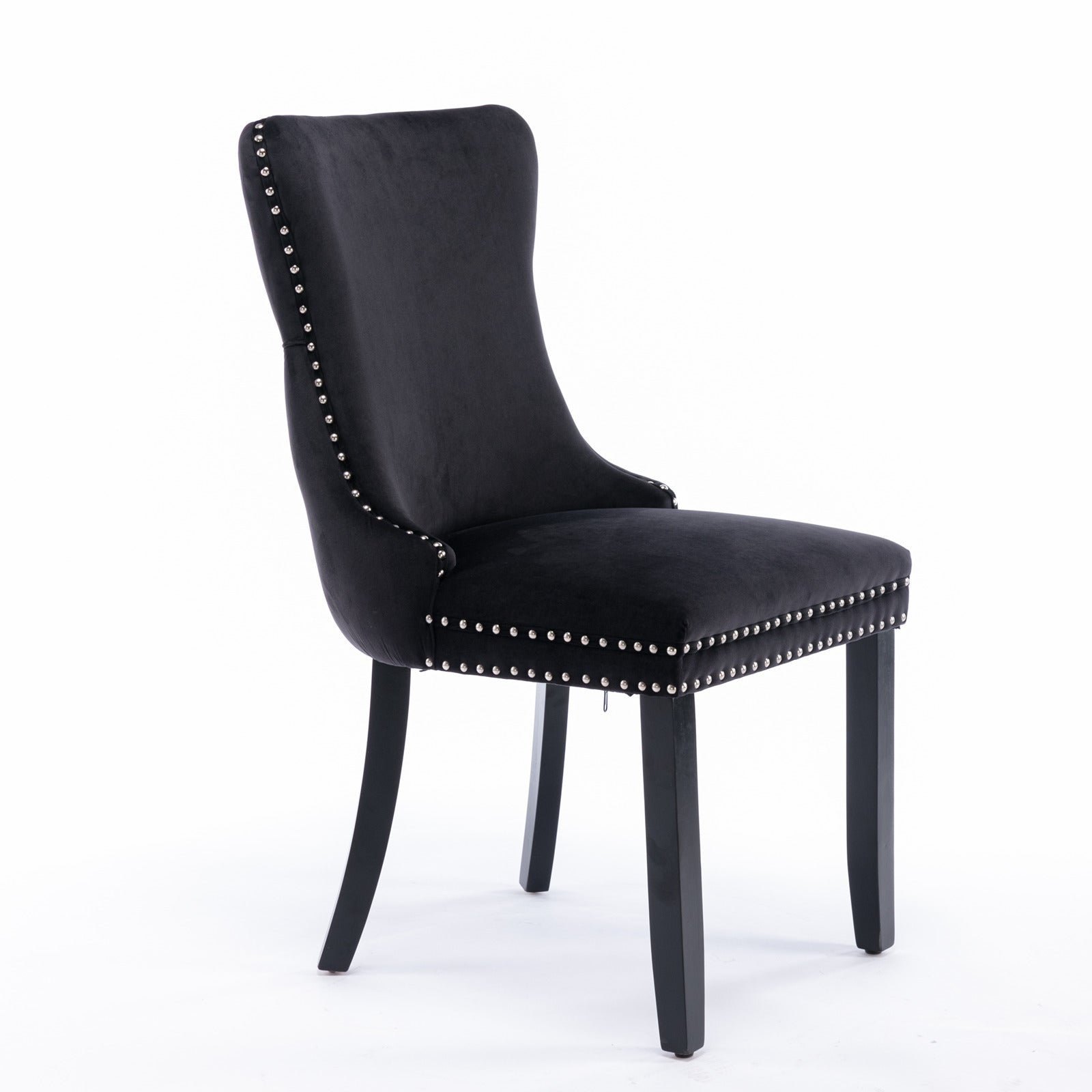 Black velvet dining chair with silver nailhead trim and dark wood legs