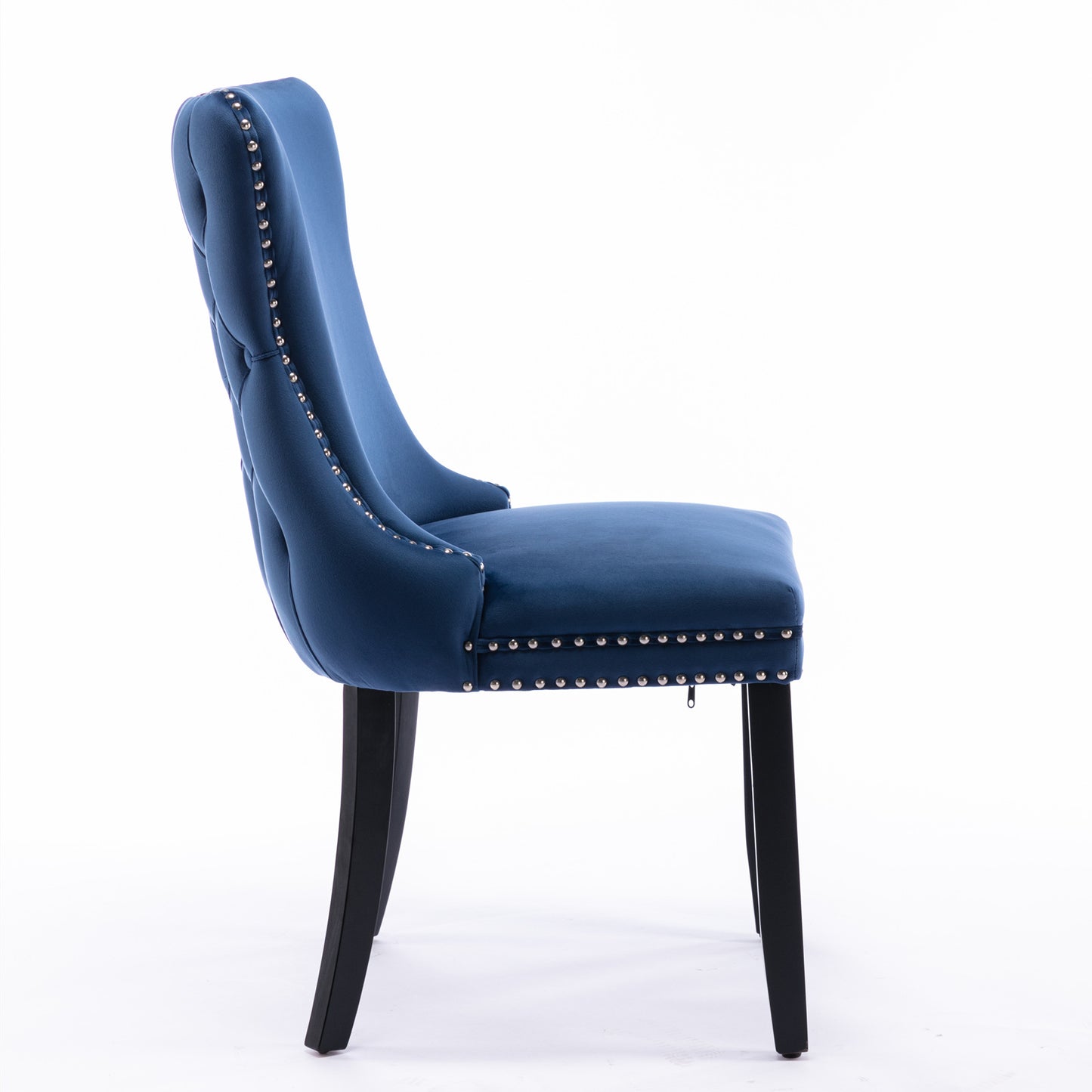 Blue velvet dining chair with tufted back and nailhead trim