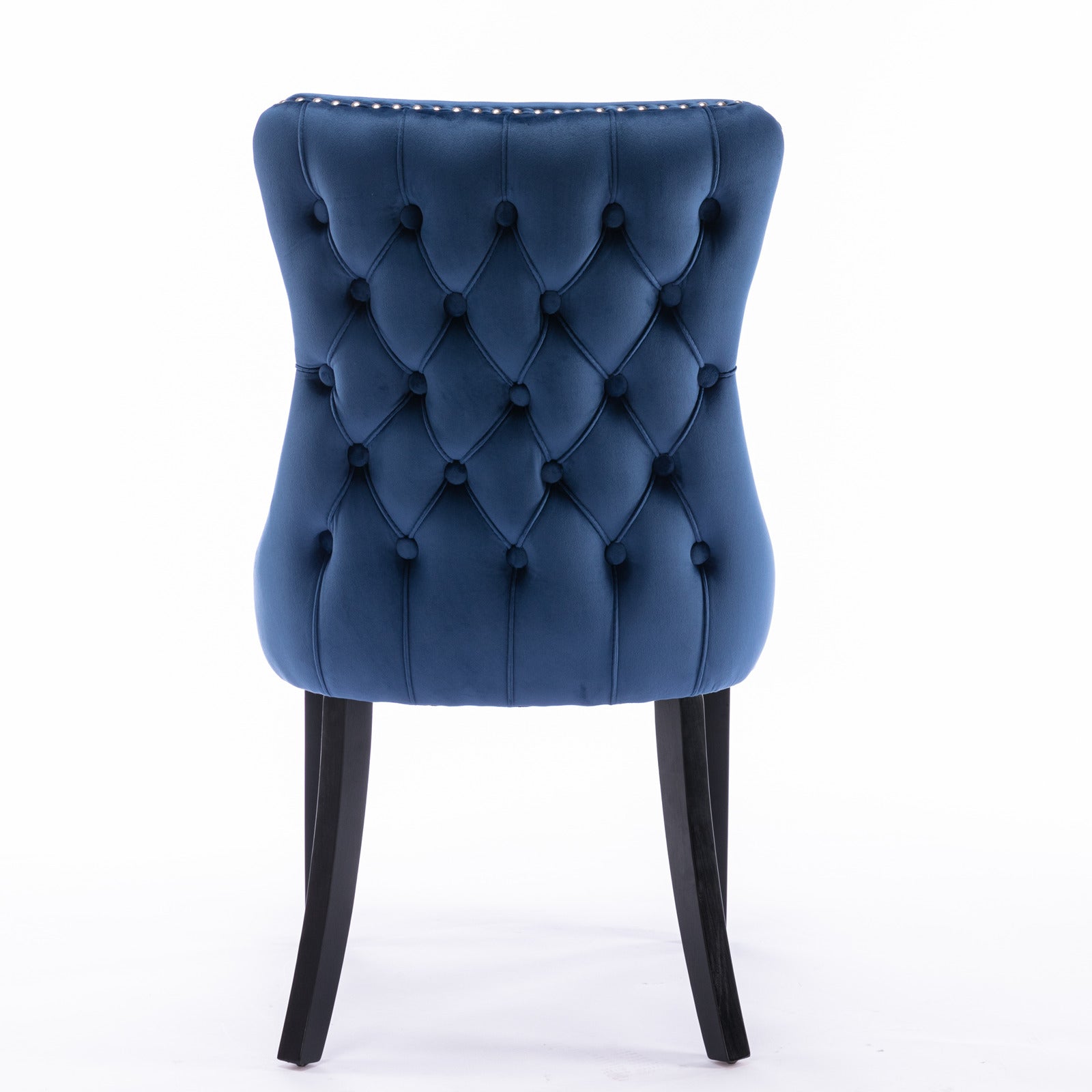 Deep blue velvet dining chair with tufted back and silver nailhead trim