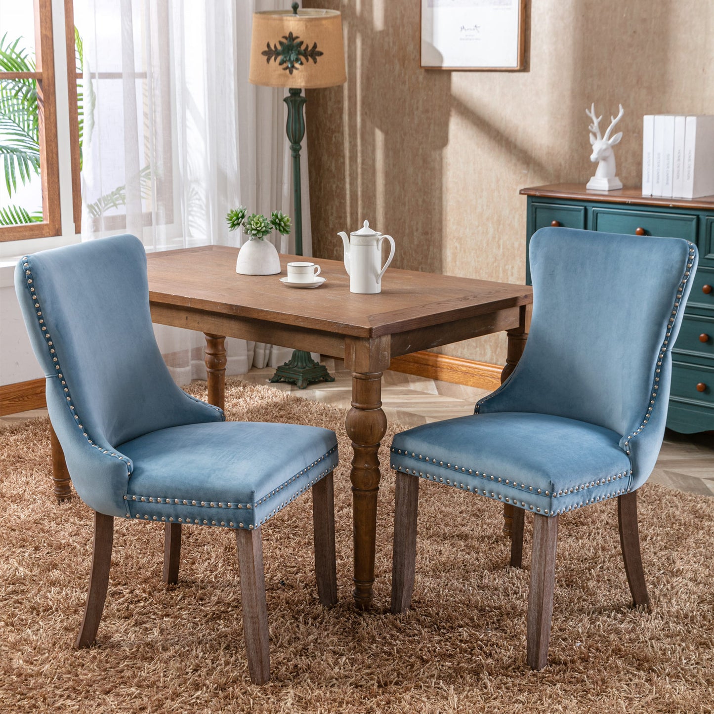 Dusty blue velvet dining chair with silver nailhead trim