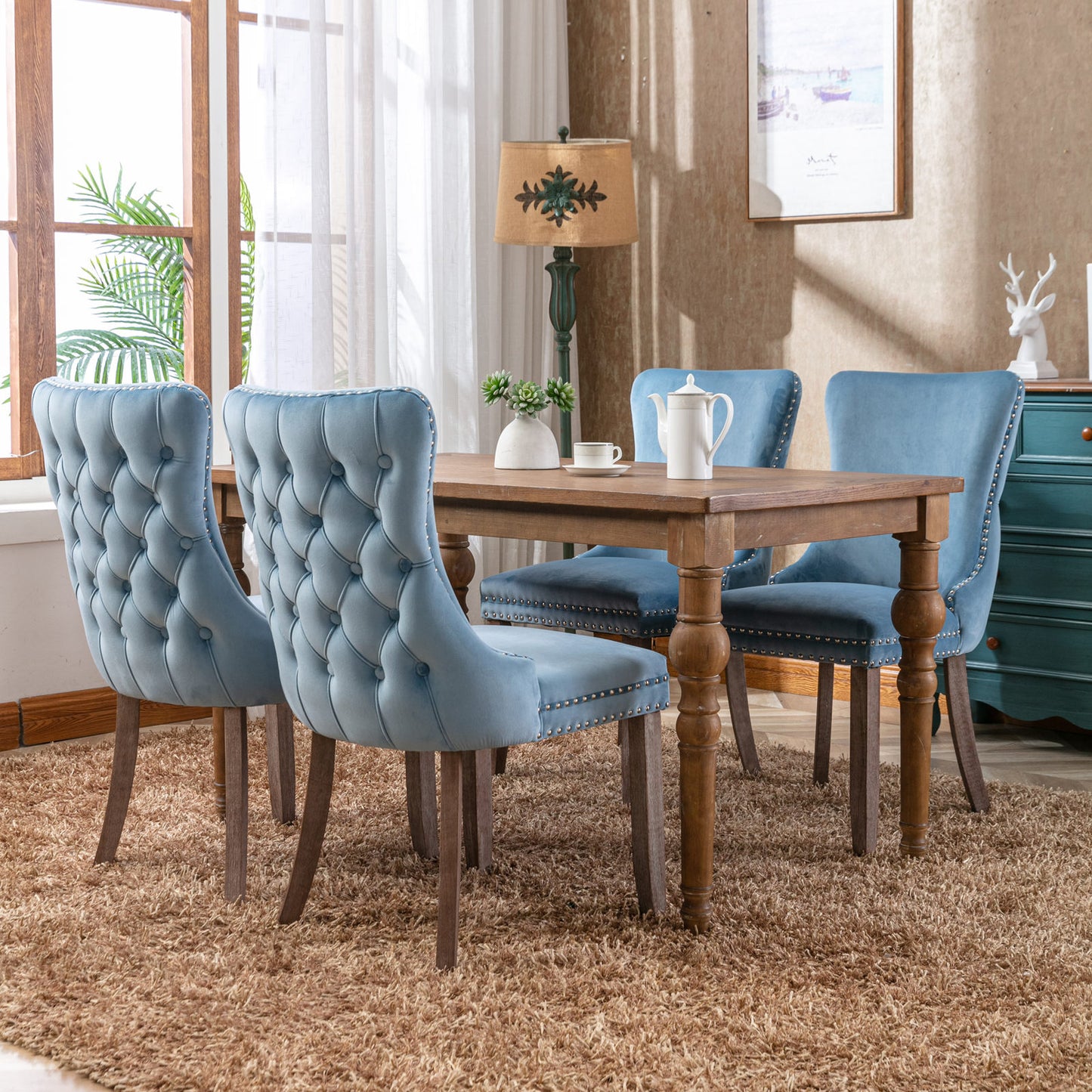 Tufted velvet dining chair with nailhead trim in sky blue