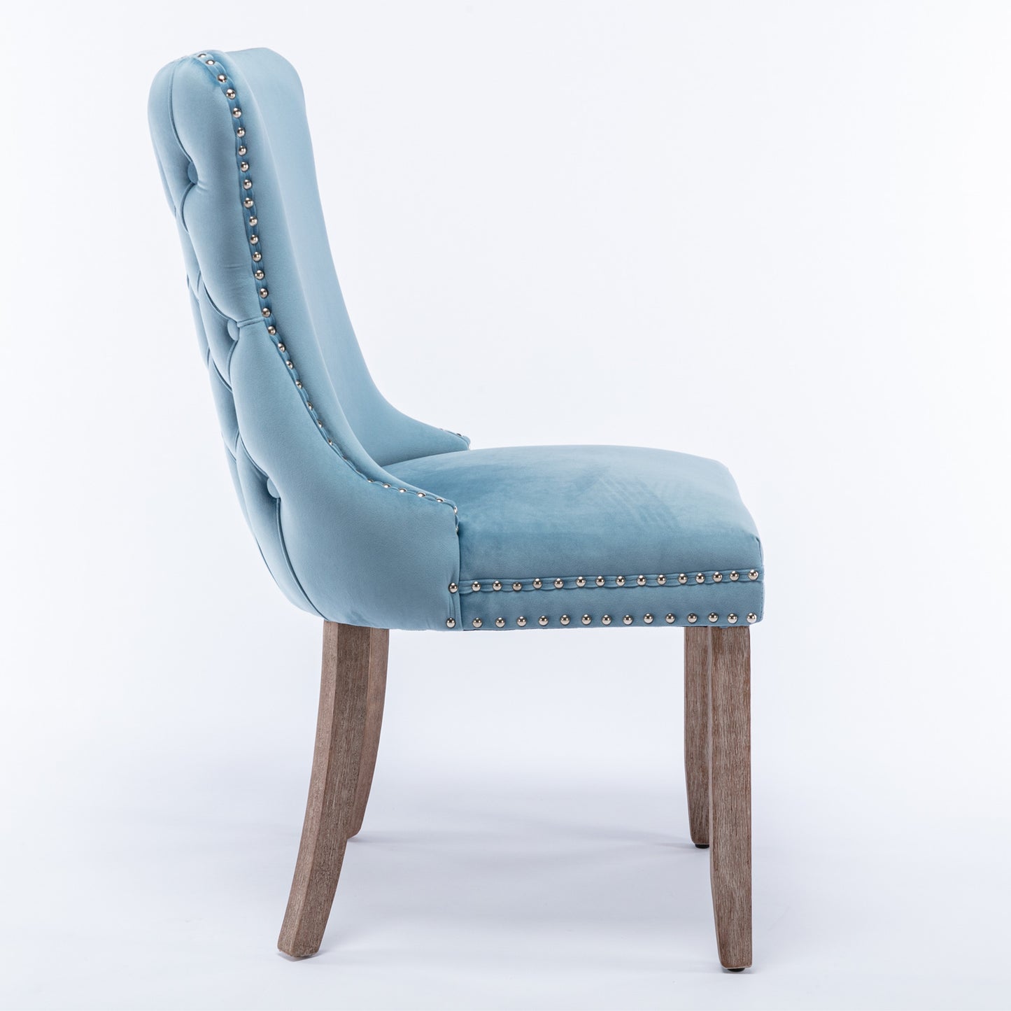 Light blue velvet dining chair with tufted back and silver nailhead trim