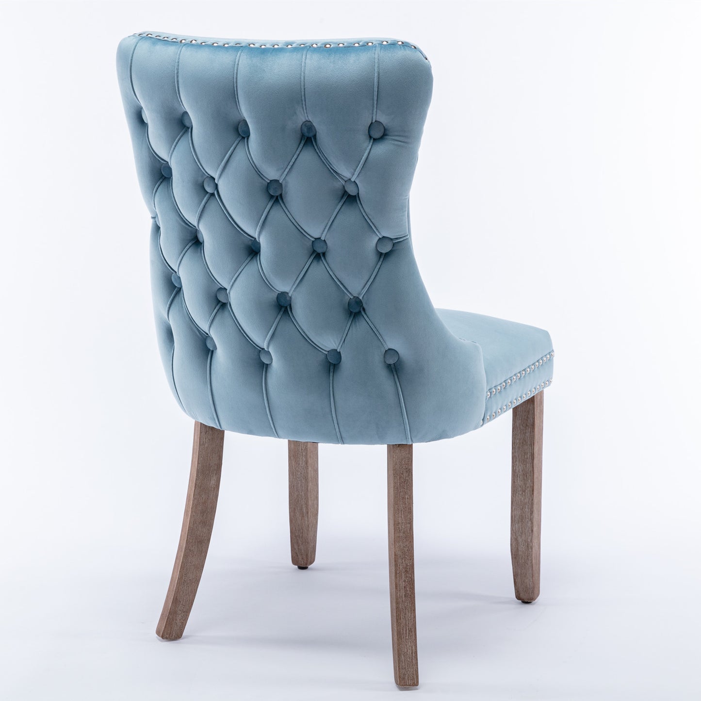 Light blue velvet dining chair with diamond tufting and silver nailhead trim