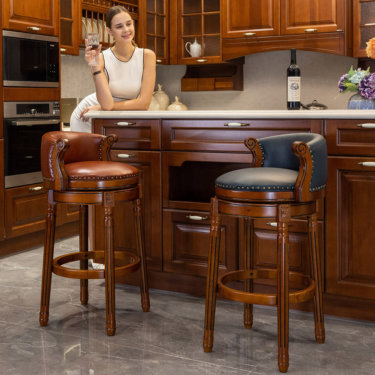 Brown leather swivel bar stool with nailhead trim and wooden legs