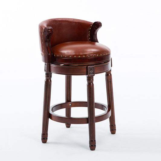 Brown leather swivel bar stool with wooden base and brass accents
