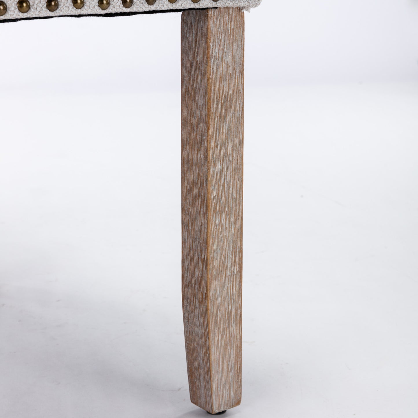 Distressed wood chair leg with carved detail