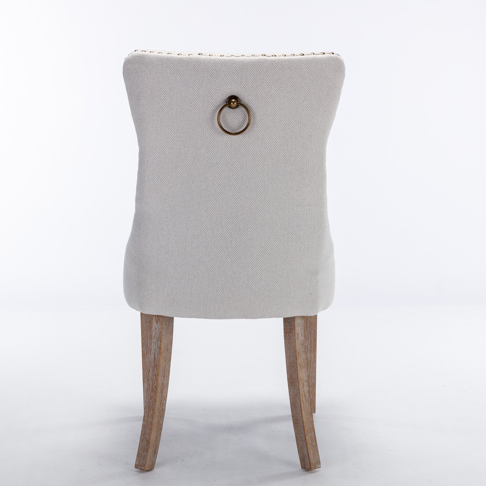 Textured light gray fabric dining chair with brass ring pull