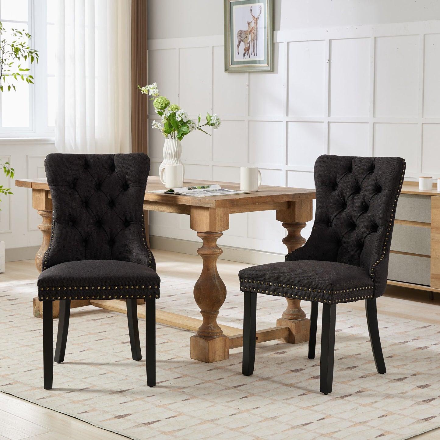 Elegant black tufted dining chair with brass nailhead trim