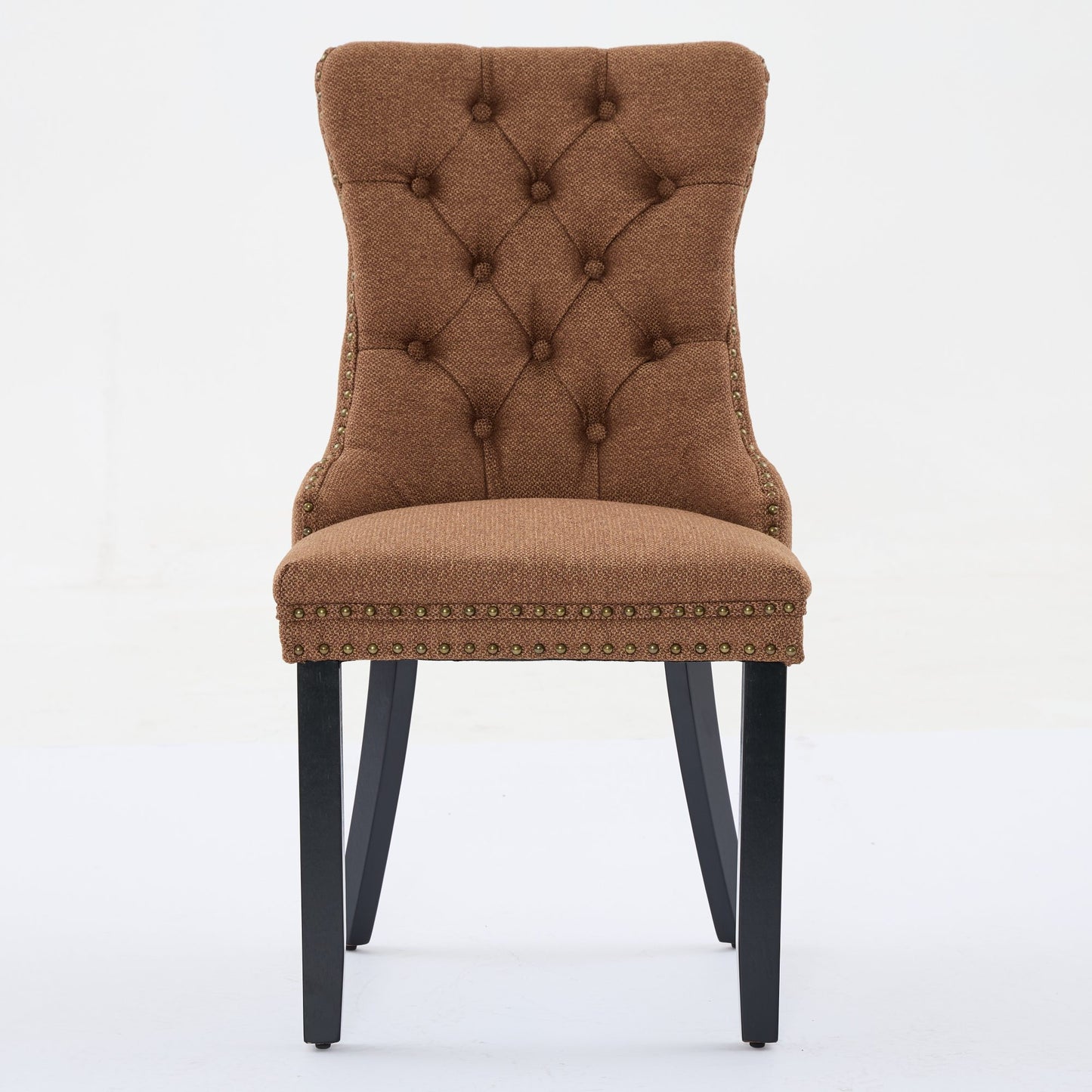 Brown tufted dining chair with bronze nailhead trim