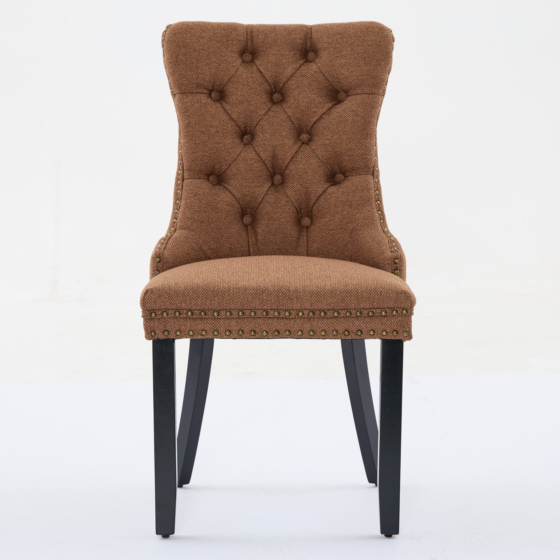 Brown tufted dining chair with bronze nailhead trim