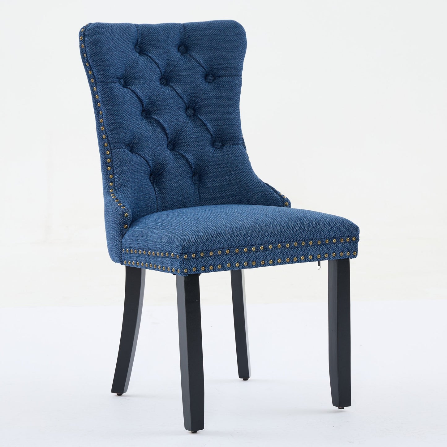 Tufted navy blue fabric dining chair with brass nailhead trim