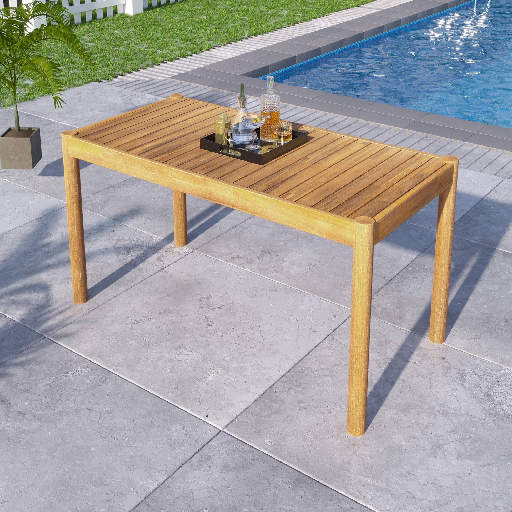Wooden dining table with slatted top and thick legs ideal for outdoor entertaining