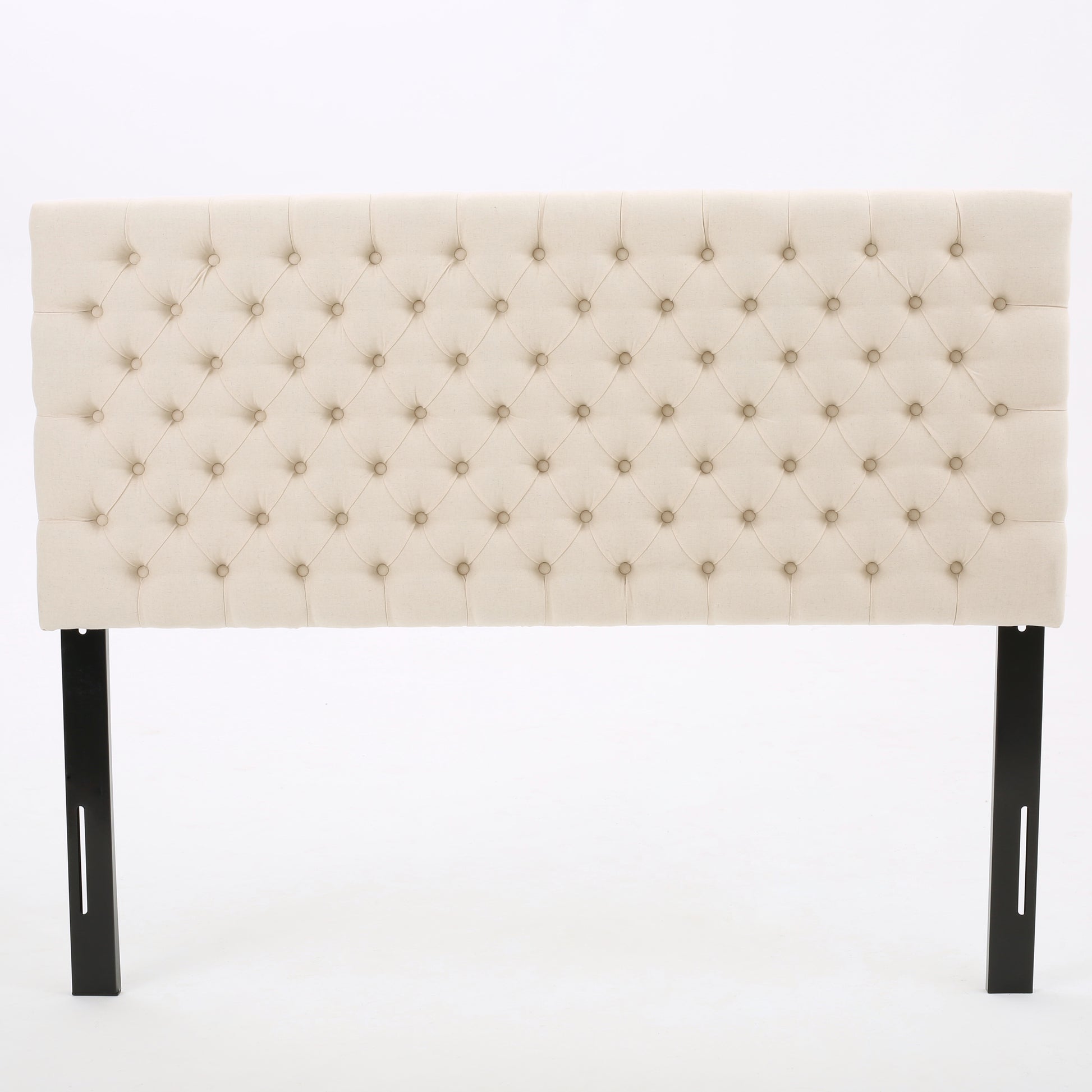 Cream tufted headboard with diamond stitching and black metal legs