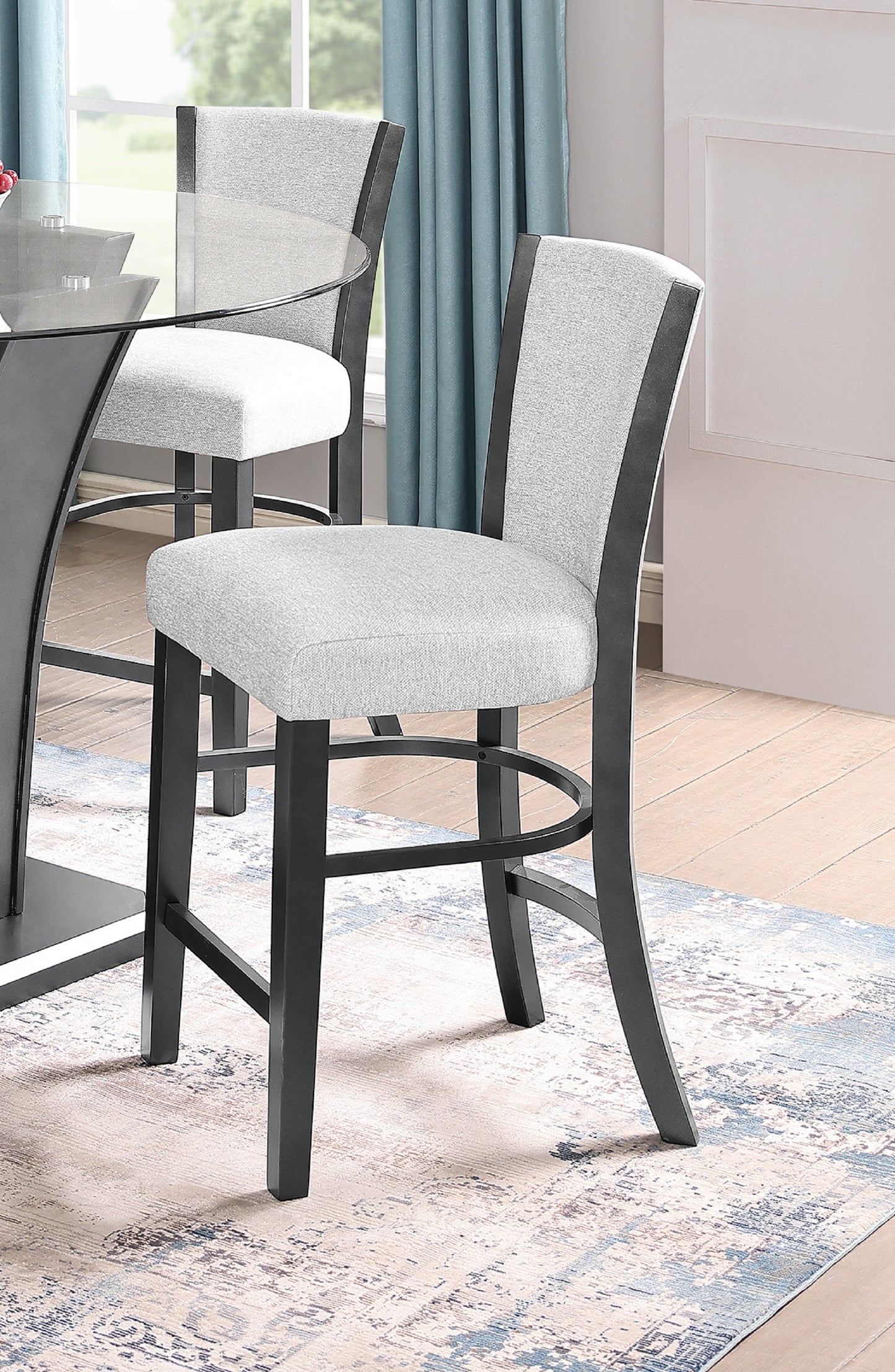 Gray upholstered bar stool with black wooden frame