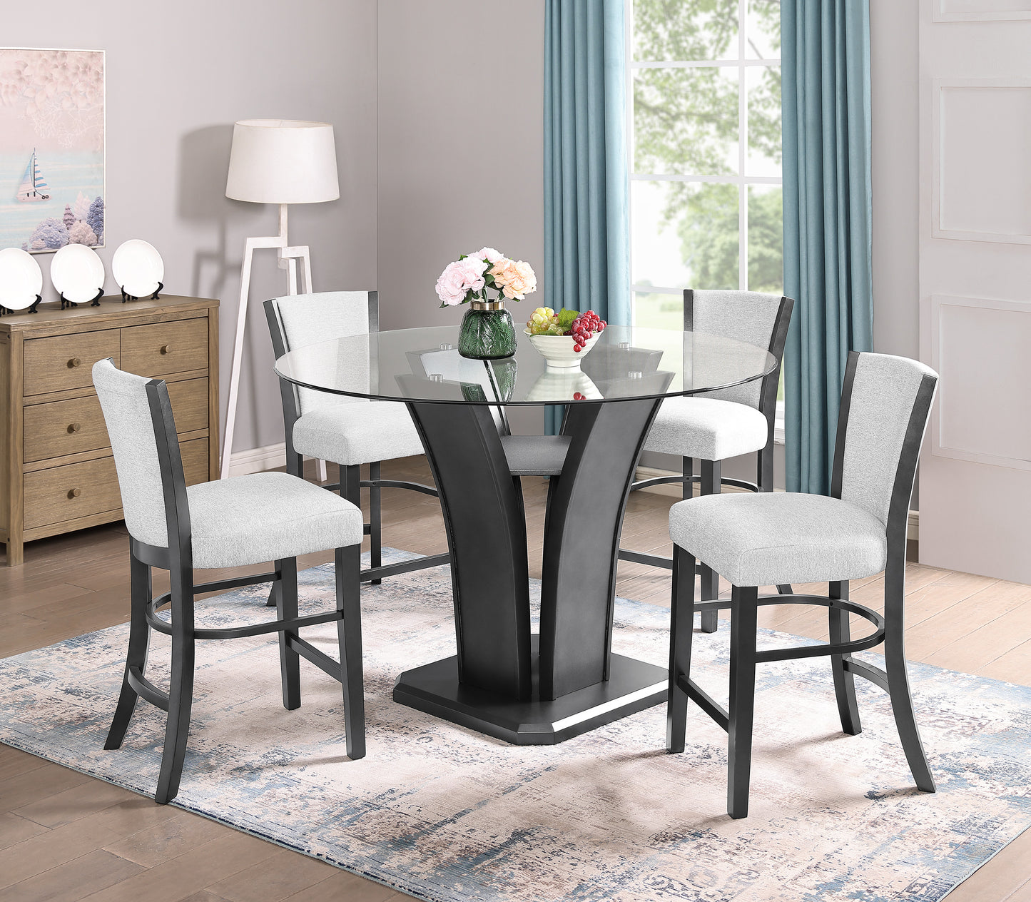 Round glass top dining table with grey upholstered stools