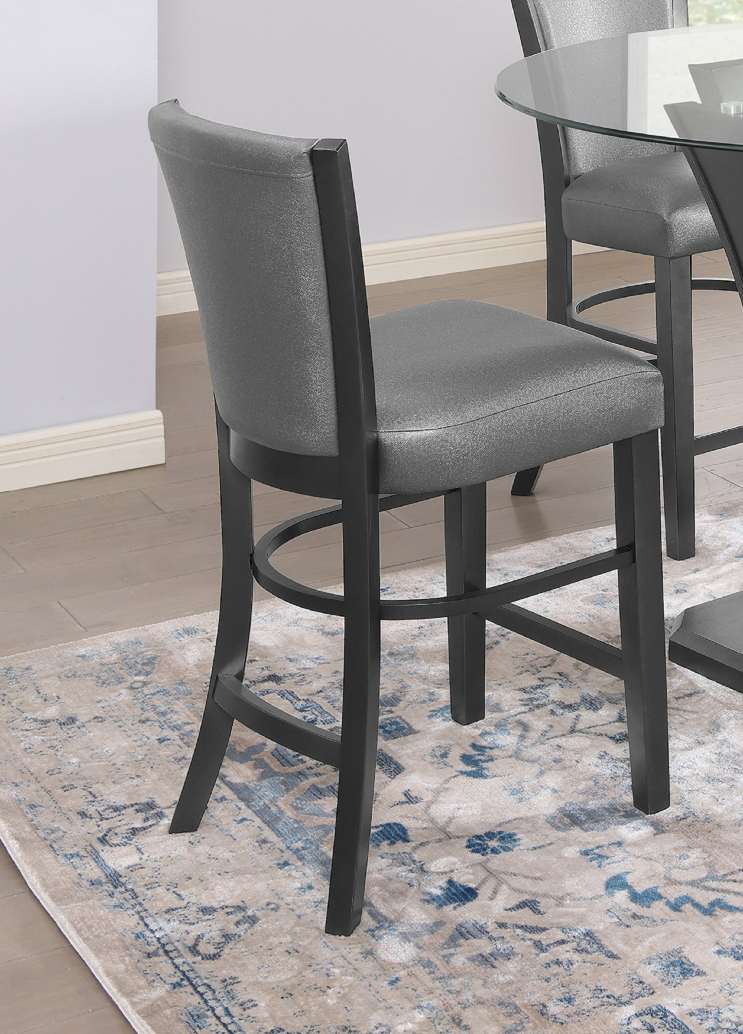 Gray upholstered bar stool with dark wood legs