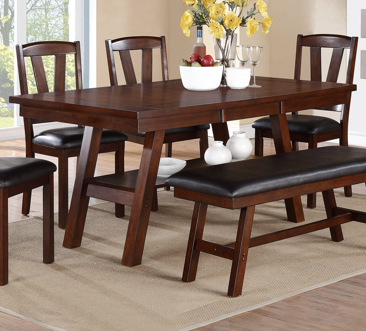 Dark cherry wood dining table with upholstered chairs and bench