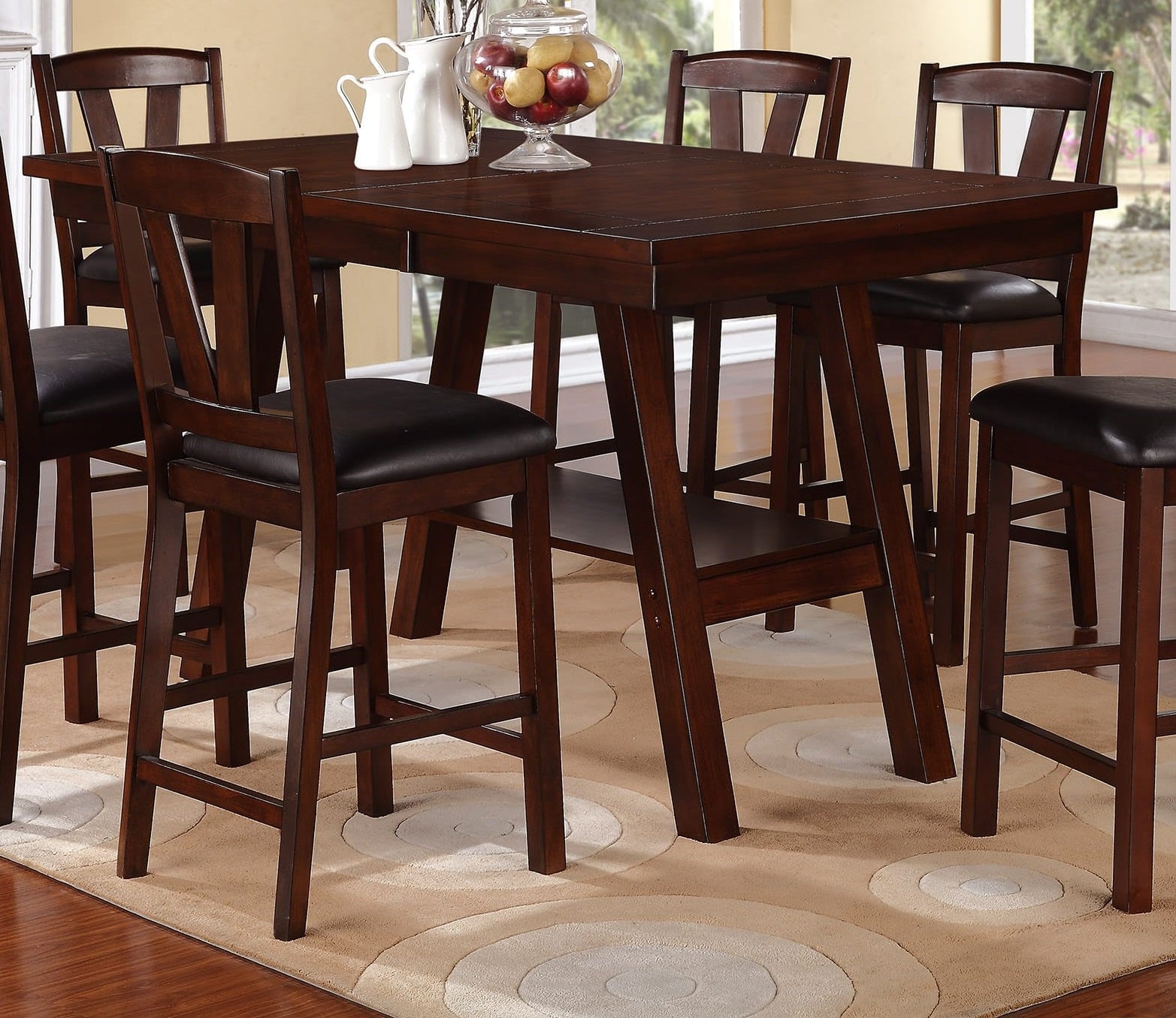 Dark wood counter height table with four matching upholstered stools