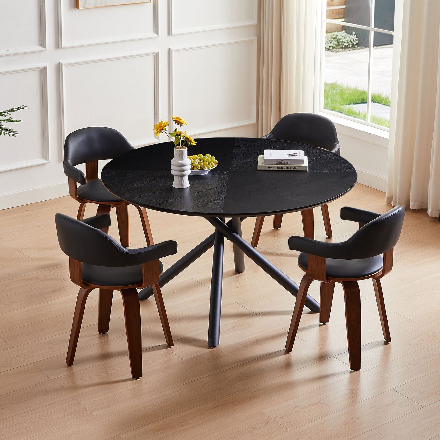 Black wood grain round dining table with four black leatherette chairs