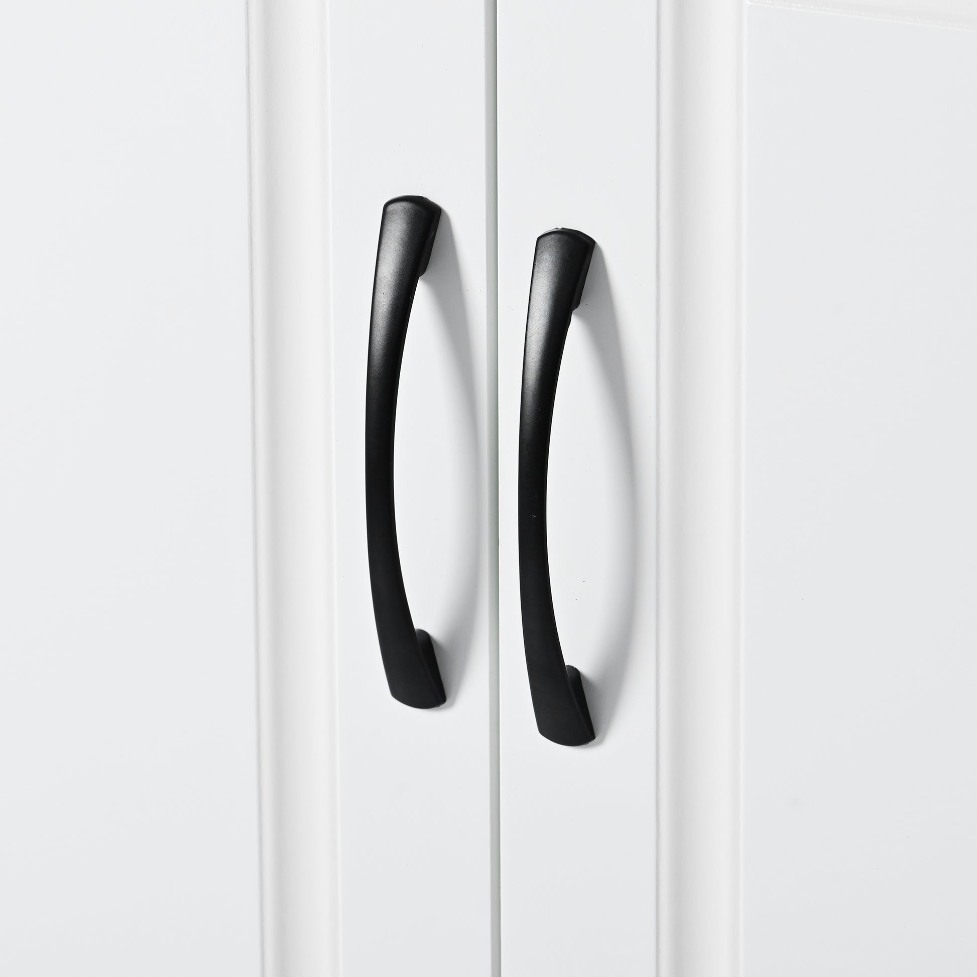 Two black modern curved cabinet door handles