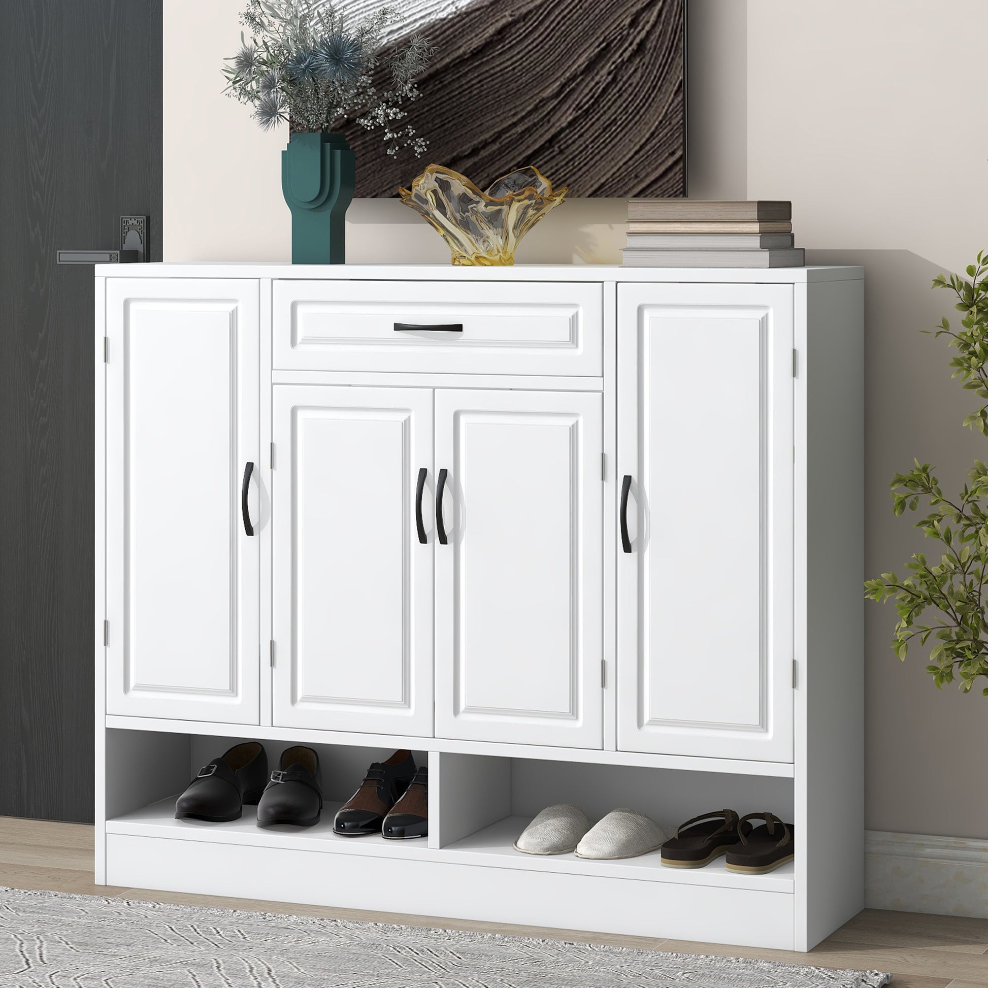 White storage cabinet with multiple compartments and shoe rack