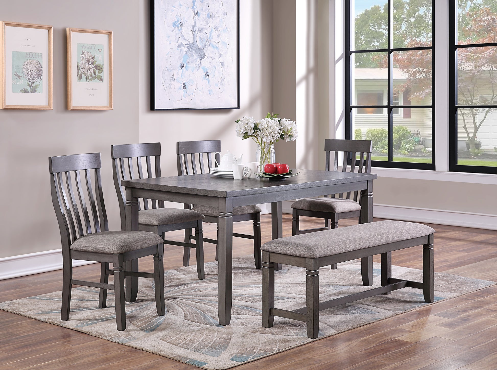 Gray dining set with six chairs and bench on patterned rug