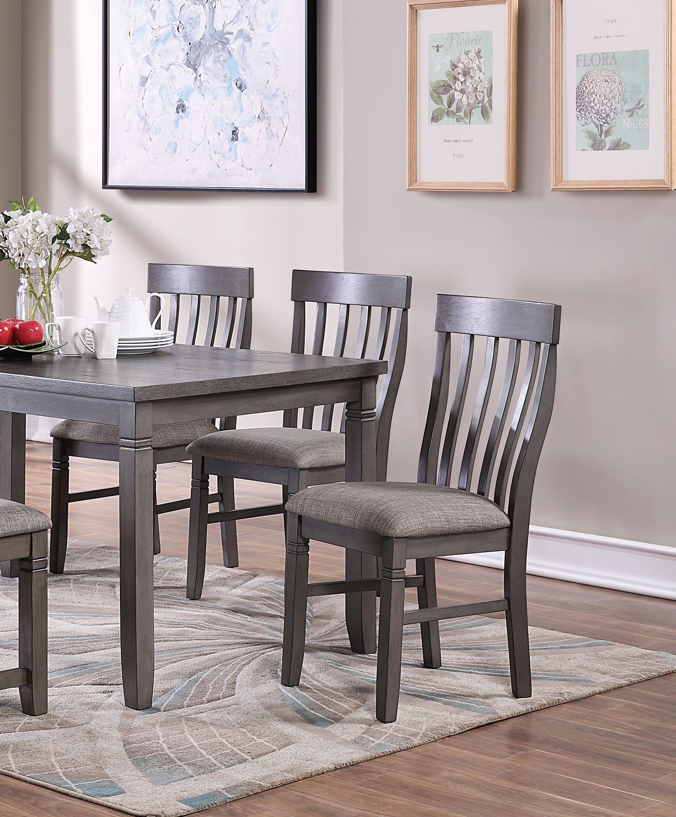 Gray wooden dining chair with curved back slats and upholstered seat