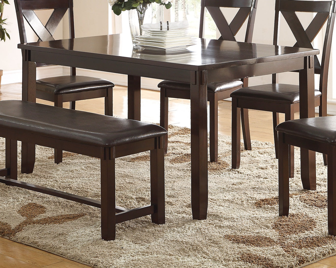 Dark espresso wood dining table and bench with faux leather cushions