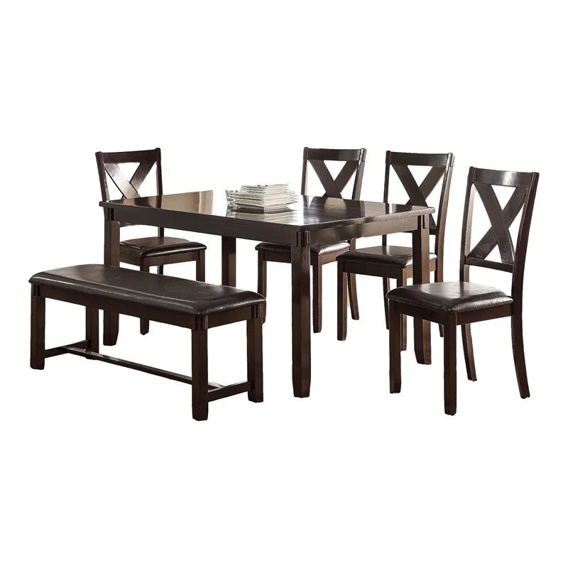Dark wood dining table set with four chairs and upholstered bench