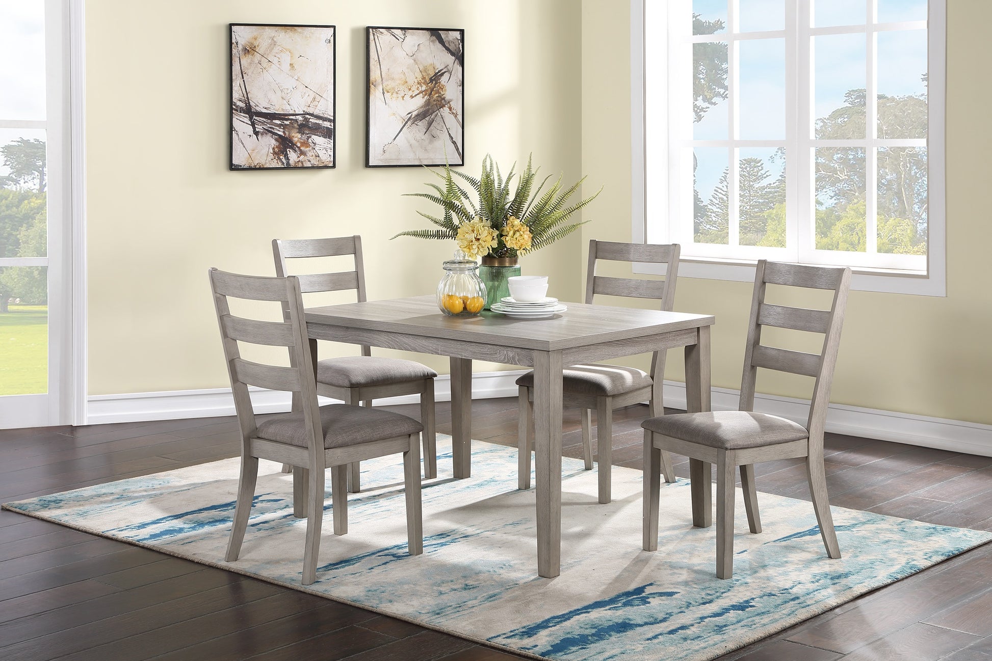 Gray wood dining table with upholstered chairs