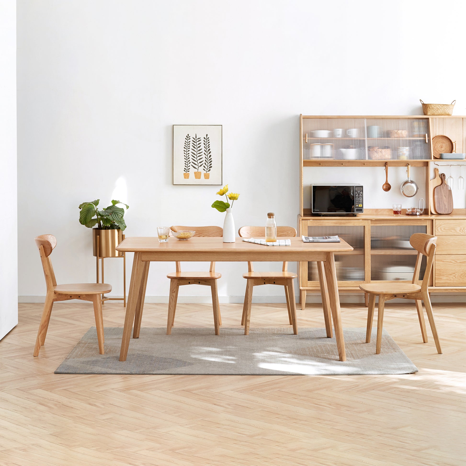 Natural wood dining table and chairs set on a rug
